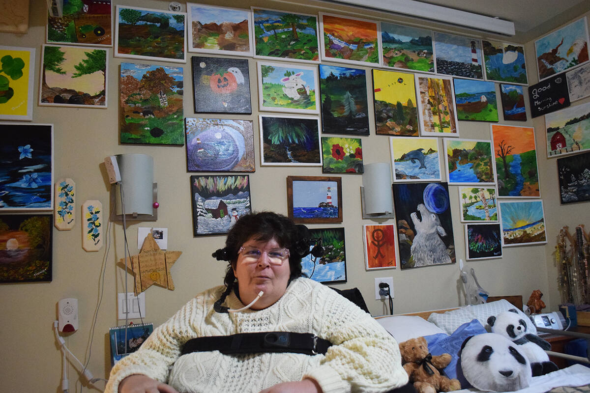 Shawna Magnusson has surrounded herself with delightgully colourful paintings of her own creation. (Ronan ODoherty/Campbell River Mirror)