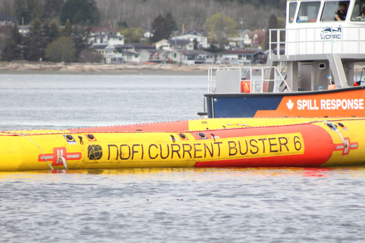 A Norwegian-designed sweep system, used to collect oil in harsh conditions, is deployed. (Austin Westphal/News Staff)