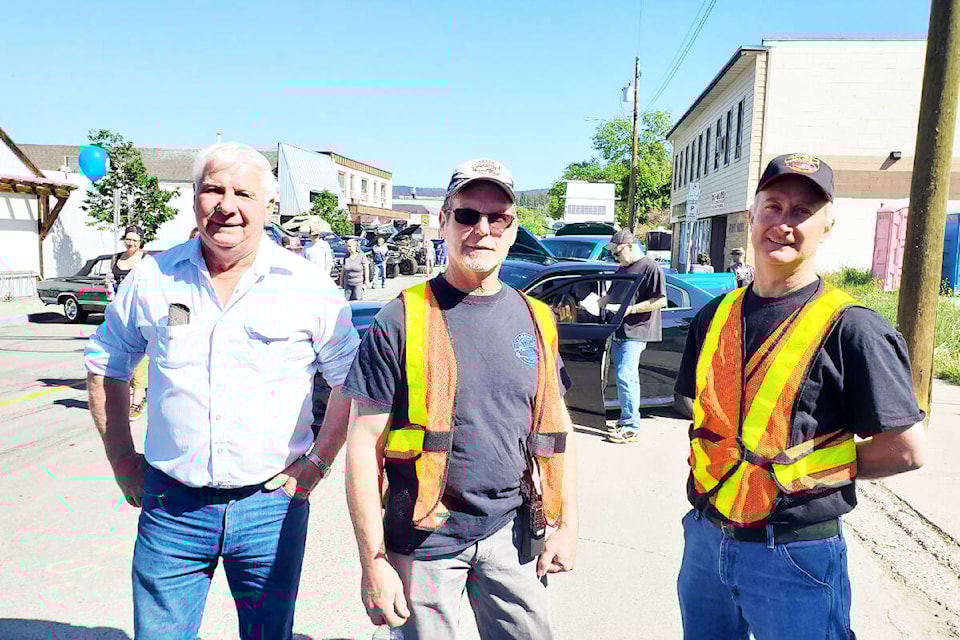 Lakers Car Club members Don Kunka, left, Ken Beck and Warren Colebank volunteer as classic parking attendants Sunday, May 28 at the club’s Show and Shine in Williams Lake. (Monica Lamb-Yorski photo - Williams Lake Tribune)