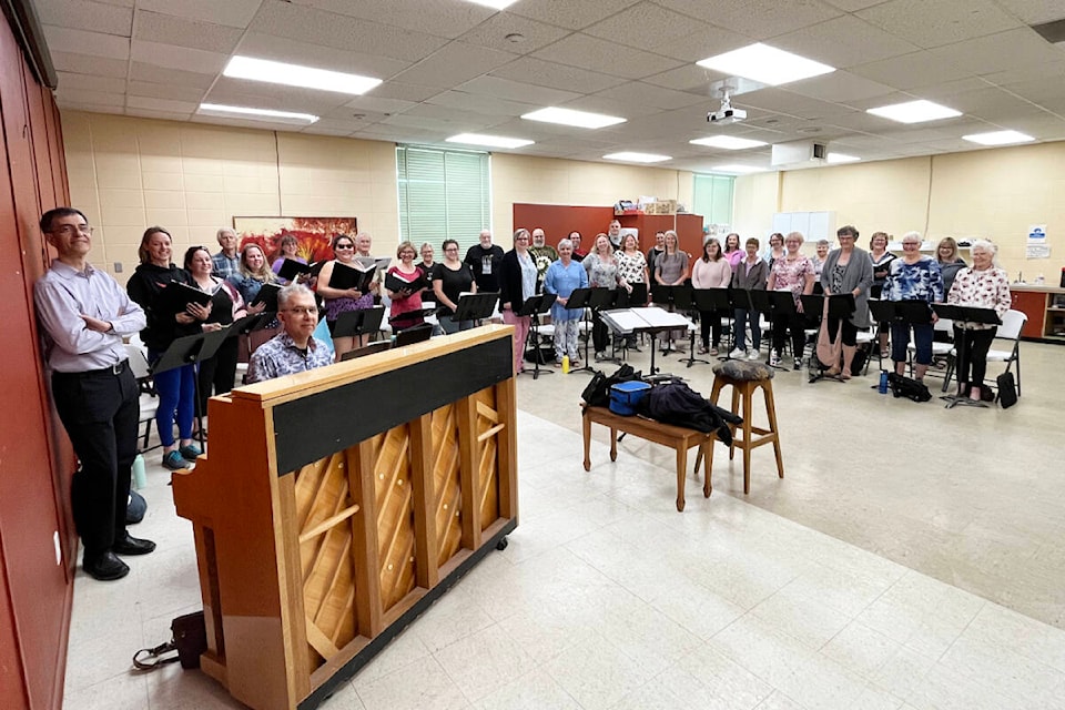 Members of the Sage Sound Singers choir were among the 30 singers taking part in a final rehearsal at the Ashcroft HUB on June 18 before they fly to New York City to perform at Carnegie Hall. Concertmaster Cvetozar Vutev is standing at right, with accompanist Dimiter Terziev at the piano and Sage Sound Singers musical director Michelle Reid at centre in blue sweater. (Photo credit: Barbara Roden)