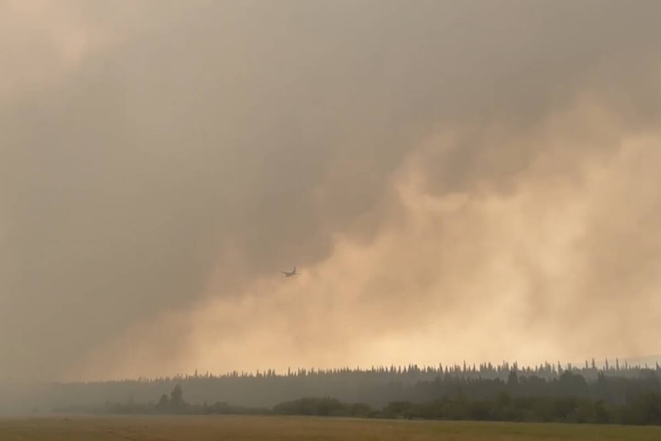 An air tanker flies toward the Anahim Peak wildfire Saturday, July 15. (Janet Carley photo)