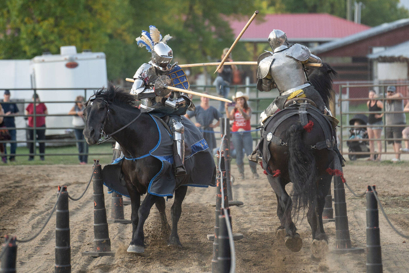 Josh Tobey (left), whos a member of jousting troupe Knights of Valour, competes in a match at the Salmon Arm Fair on Sept. 8, 2023. (Lindsay Adam)