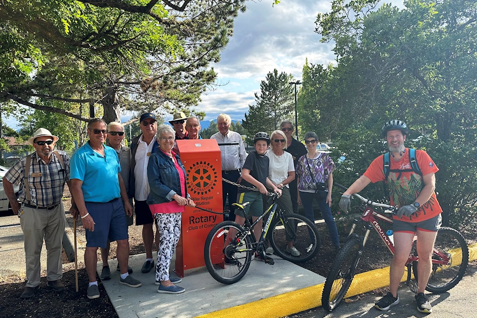  Members of the Rotary Club of Comox proudly showcase the new bike repair station installation at the Comox Community Centre, alongside local cycling enthusiasts Collin and Gabriel Richardson and Town Councillor, Ken Grant. 
