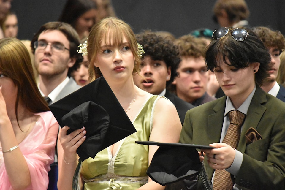 A grad reflects on the large crowd before the June 26, 2024 commencement ceremony.