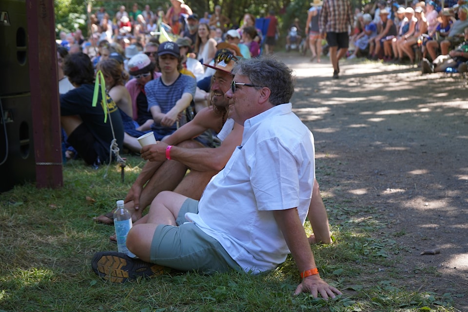 Vancouver Island MusicFest producer and artistic director Doug Cox takes in the music of Moira & Claire Sunday afternoon (July 14) at the Woodland Stage.