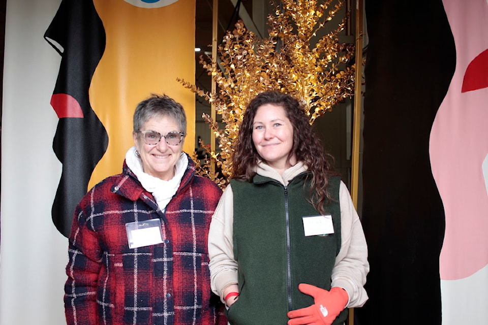 Patsy O'Brien and Genevieve Couture welcome people to the event.