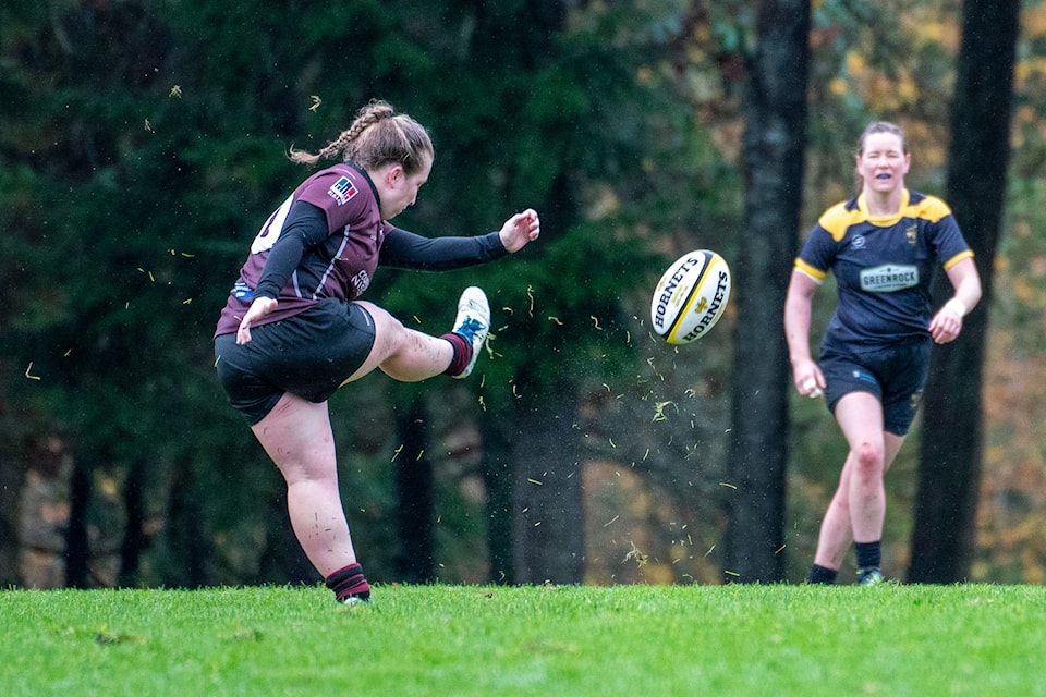 Flyhalf Lauren Sargent kicking.