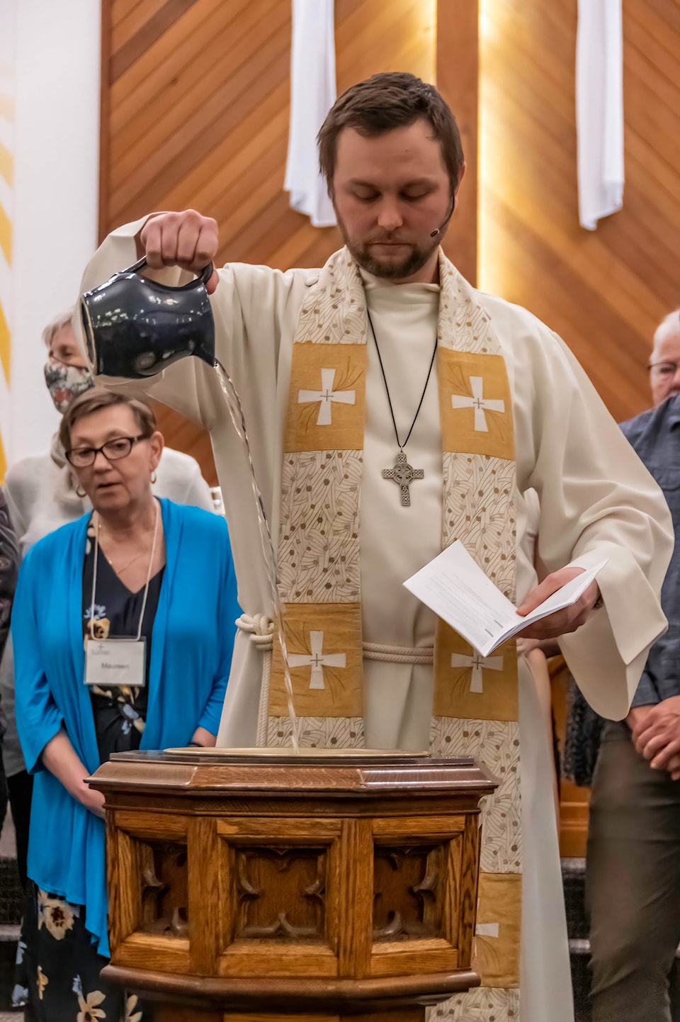 the-rev-ryan-slifka-fills-the-baptismal-font
