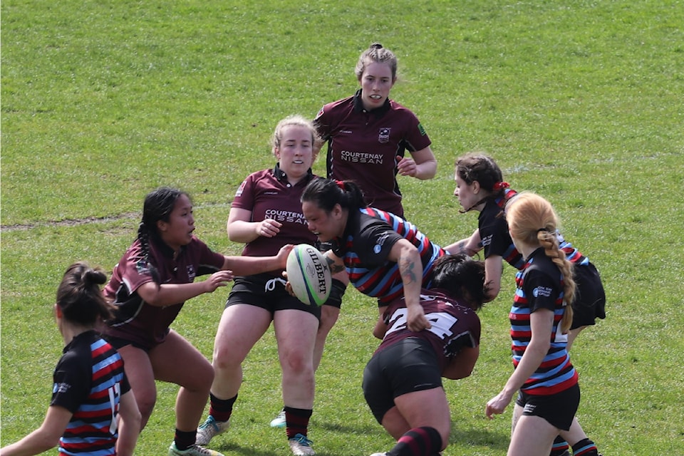 Hook Natalie Nguyen making a tackle.