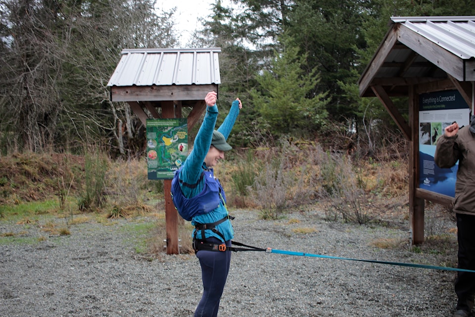 Runner Kacey Wall finishes her New Year's Eve marathon to raise funds for the Puntledge Forest.