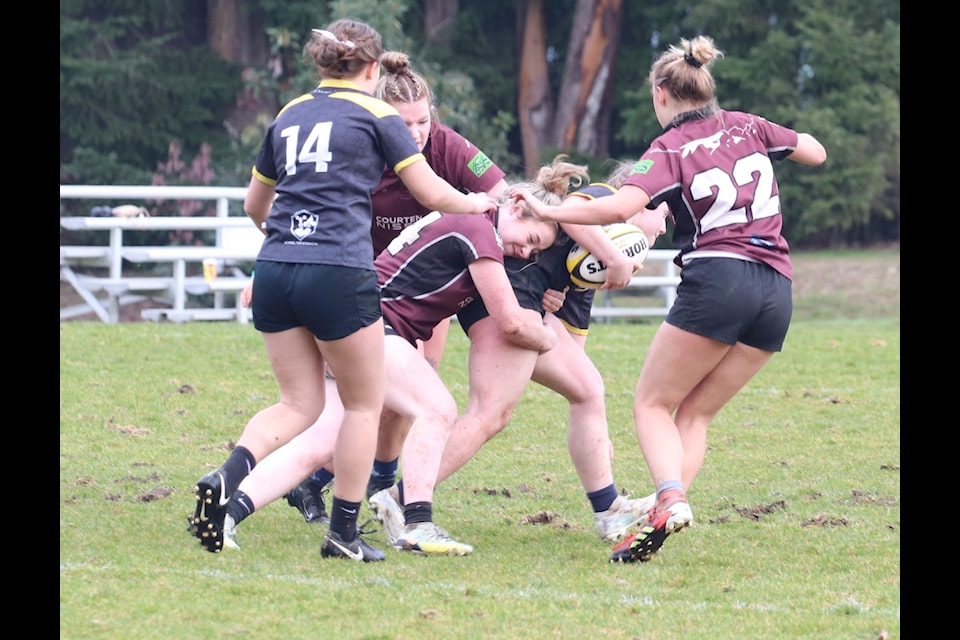 Centre Sienna Stigant tackling a Nanaimo Hornet player
