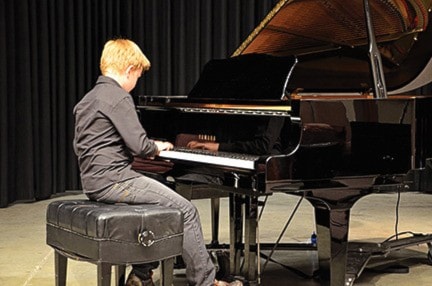 Theo Lemay enjoying the benefit of the CVPS piano