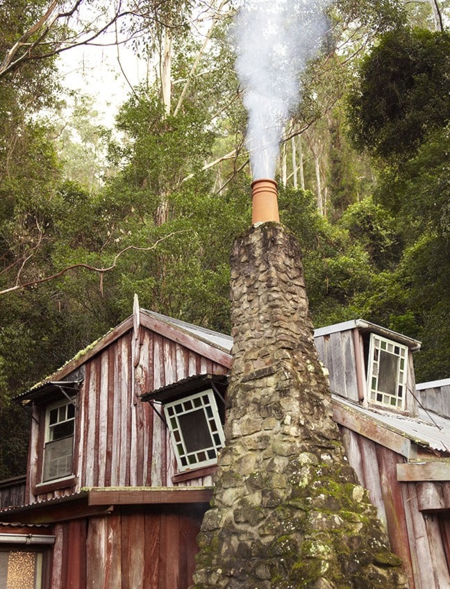 Country home with smoking chimney pot