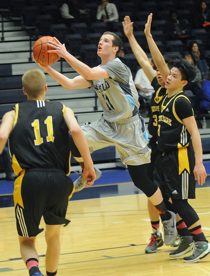 Hank Magdanz drives past Duchess defenders.
EVAN SEAL PHOTO