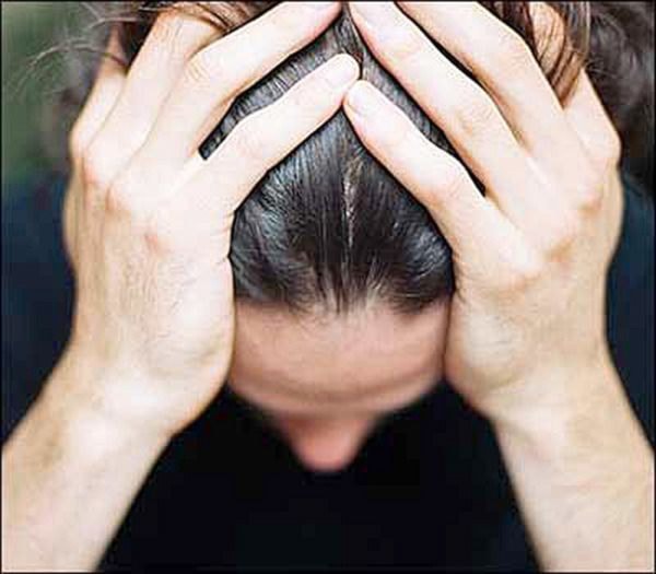 **Hi res** Close-up of a man's hands on his head