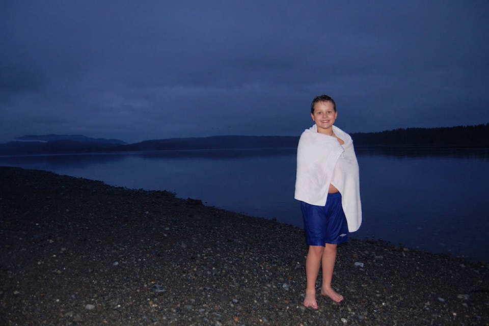 Sylas Thompson, 11, on Tyee Spit after a chilly swim on Thursday. He’s planning a daily dip beginning Feb. 1 until he raises a total of $30,000 for the Grassroots Kind Hearts Society and the Campbell River Women’s Resource Centre. Photo by David Gordon Koch/Campbell River Mirror