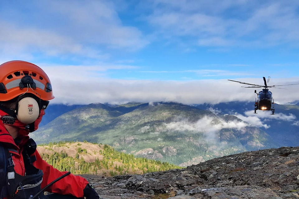 Search and Rescue personnel await the helicopter to extract the injured mountaineers. Photo courtesy Comox Valley Search and Rescue