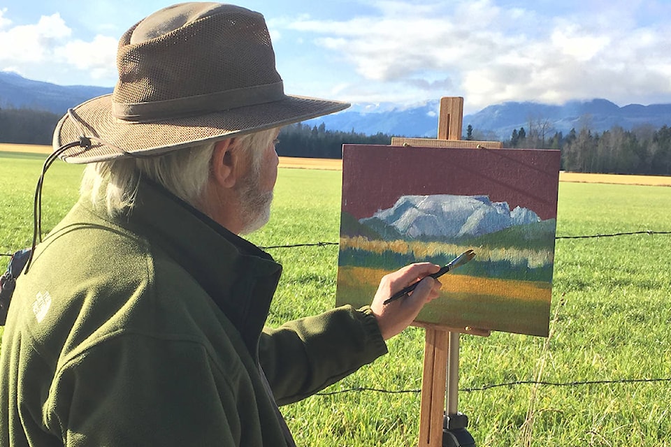 Local artist Neil Havers took advantage of a sunny Saturday for some plein air painting. He was spotted on Marsden Road, creating a painting of the Comox Glacier. Photo by Terry Farrell