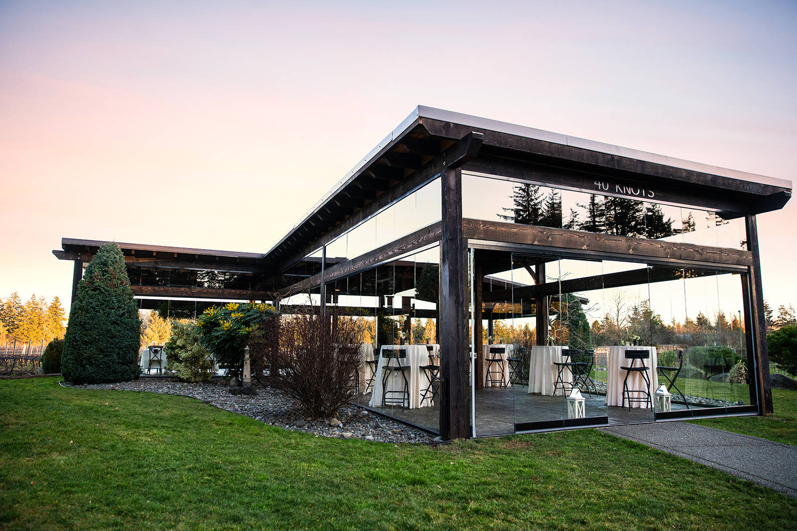 Next to the Salish Sea, with a view of the glacier, 40 Knots Winery visitors can relax in the Cellar Tasting Lounge or outside on the heated and recently renovated Vineyard Terrace, while enjoying a flight of red or white.