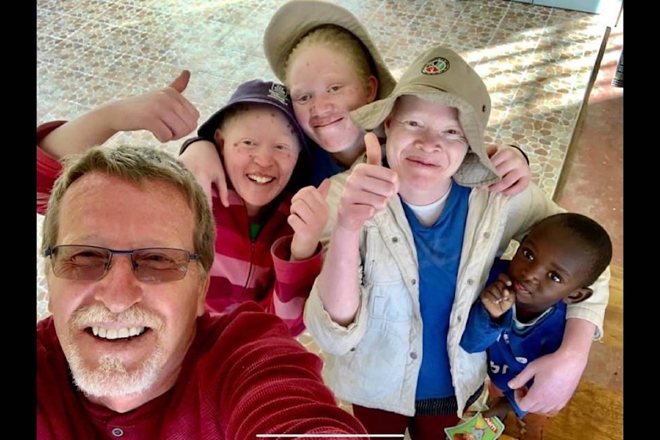 Neil Moreau in a selfie with some of the children in Kenya. (Facebook)