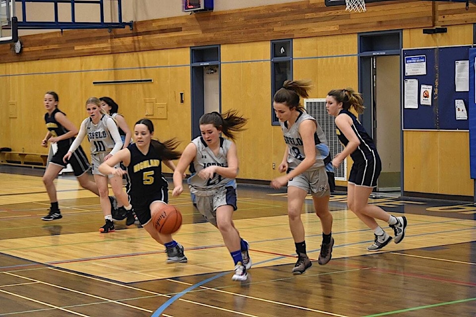 The senior girls basketball teams from Isfeld and Highland engaged in a close game Dec. 16 at Isfeld Secondary. Scott Stanfield photos