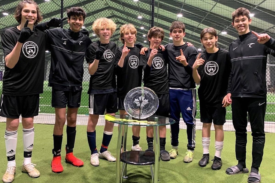 The U15 boys are pictured with the winner’s cup at the Pacific FC Winter Classic soccer tournament in Langford. Photo supplied