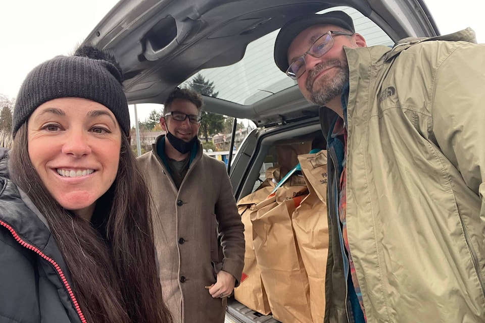 Chantal Stefan and her adult EDAS team (left, Ryan Titley - teacher admin from Heritage Online Christian School; right, David Randall, art teacher at G.P Vanier Secondary School) load up the van and head out to Vancouver for the final run of 2021. Photo by Chantal Stefan