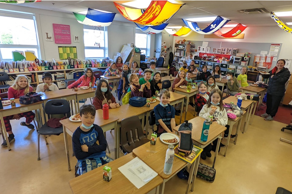 The École Robb Road Grade 4 class had a pizza party, thanks to Rachel Orthner’s winning entry in the Comox Valley Record Design An Ad contest.