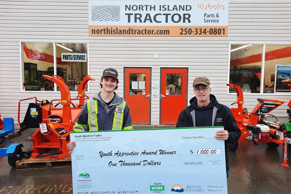 Cole Barker, heavy duty apprentice at North Island Tractor, receiving his $1,000 award from Murray Shold, Youth Work in Trades coordinator. Photo SD71/Steve Claassen