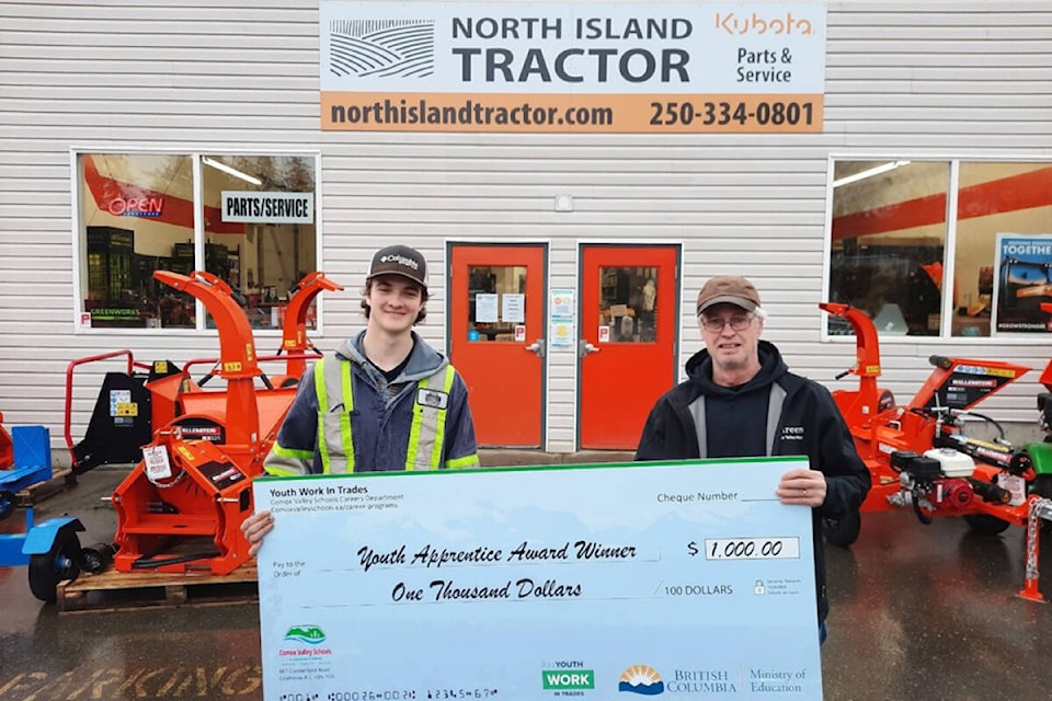 Cole Barker, heavy duty apprentice at North Island Tractor, receiving his $1,000 award from Murray Shold, Youth Work in Trades coordinator. Photo SD71/Steve Claassen