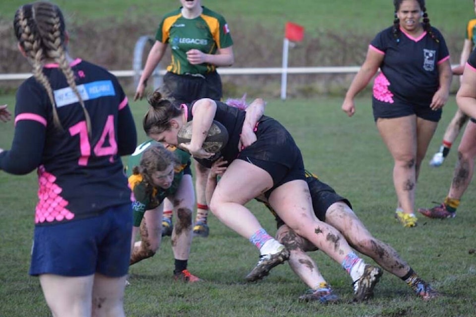 Winger Liz Adams getting tackled. Photo by Carlie Beaulieu