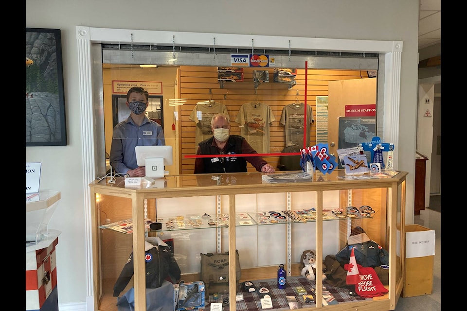 Griffin Moquin and Gary Wiffen volunteering at the front desk at the Comox Air Force Museum. Supplied