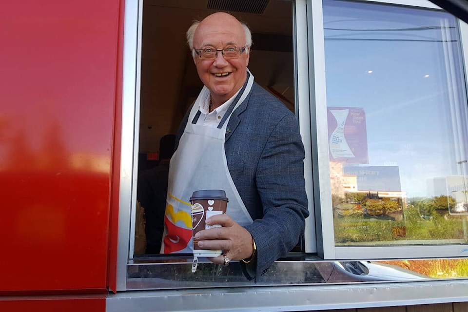 Former Comox Valley Record publisher Keith Currie, seen here volunteering at the Ryan Road McDonald’s on McHappy Day, was a long-time board member with the Comox Valley Exhibition. Black Press file photo