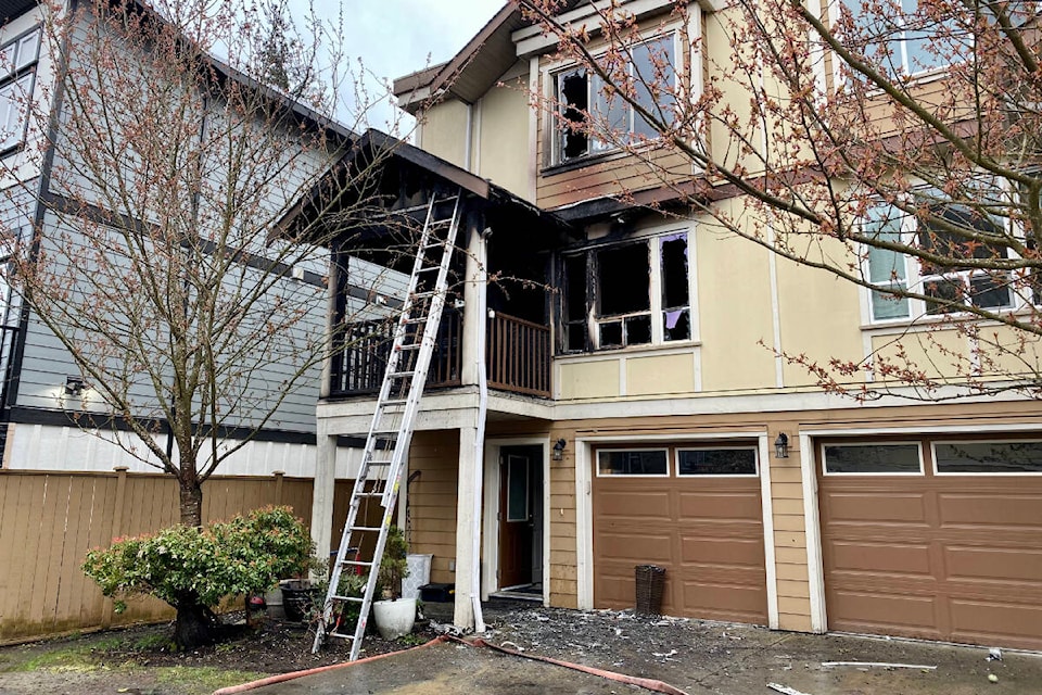 West Shore fire crews responded to a townhome fire in Langford Saturday evening, which left a family pet dead. (Justin Samanski-Langille/News Staff)