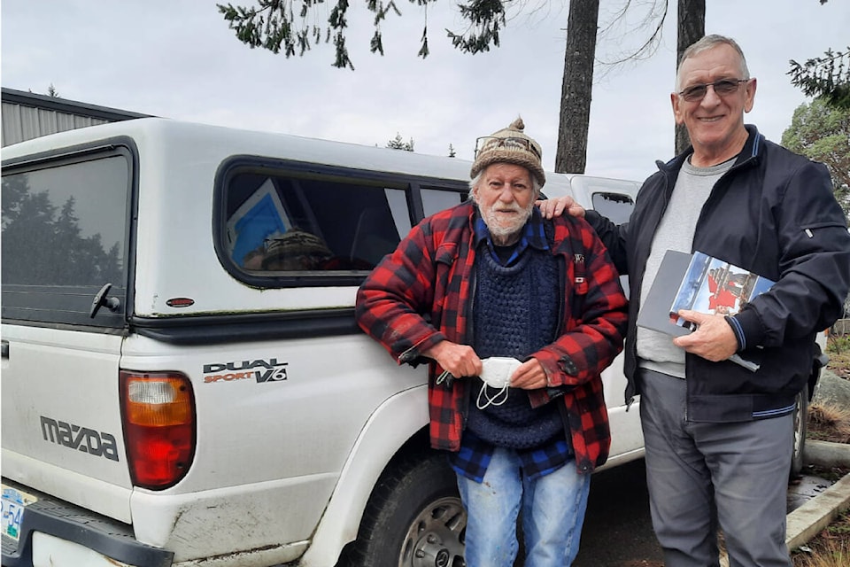 Painter Ken Kirkby stands with photographer Bryan Walwork - Photo by Caila Holbrook