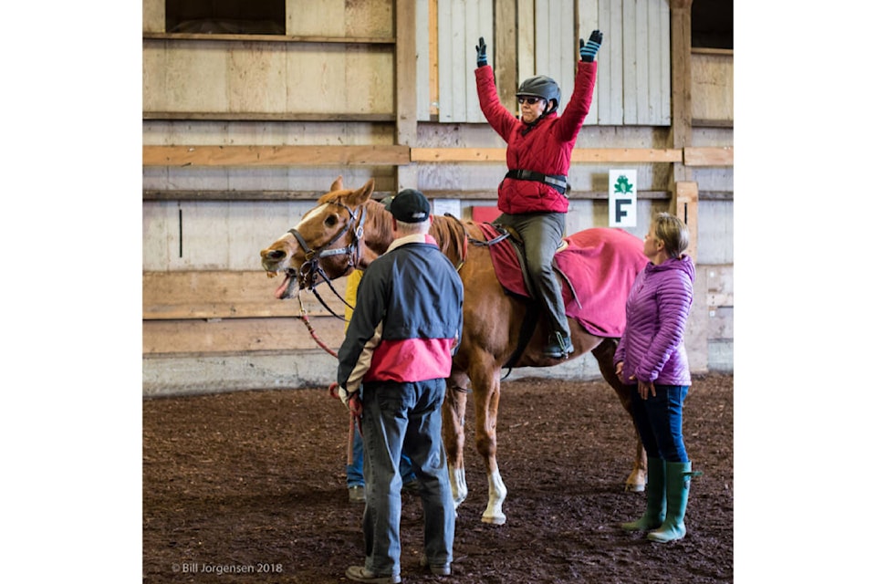 Even the horse appears to be enjoying itself during a Comox Valley Therapeutic Riding Society session. Photo by Bill Jorgensen