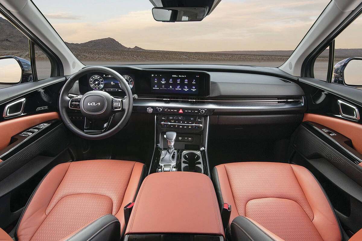 The gauges and touch-screen are contained within a thin panel that stands apart but is set into the dash. Passenger room is similar to that of the Sedona, but the Carnival has more cargo capacity. PHOTO: KIA
