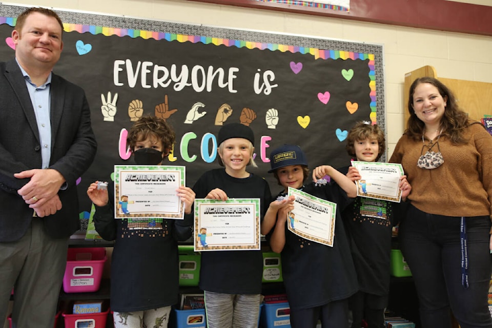 SD 71 Director of Instruction Jay Dixon with Primary 2nd place winners: Oscar Silverstein, Wilder Petch, Everett Dickens and Glen Nasadyk and Grade 3 teacher Kathryn Ney from Cumberland Community. Photo, SD71