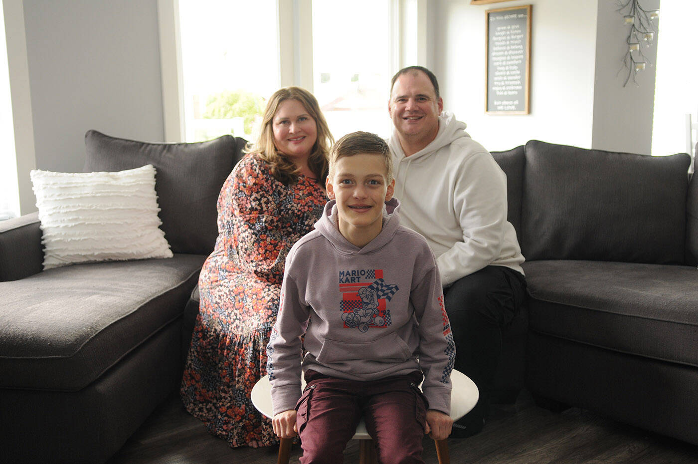 Thirteen-year-old Madden Wicker-Vriend, seen here with his parents Eryn and Jesse on May 27, 2022, is on dialysis at home in Chilliwack and is looking for a living kidney donor. (Jenna Hauck/ Chilliwack Progress)