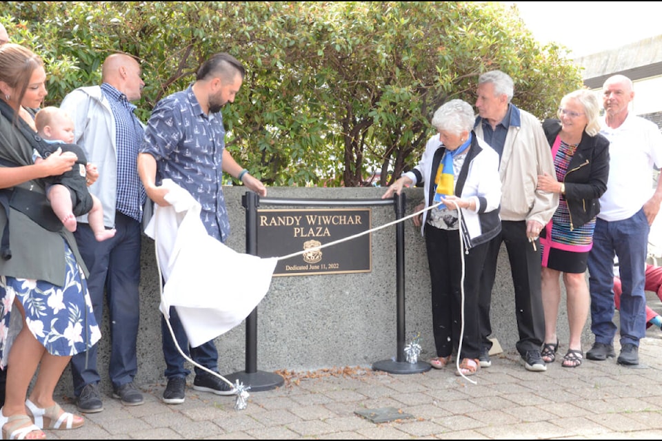 The plaque for former City of Courtenay employee Randy Wiwchar was unveiled Saturday morning at the plaza renamed in his memory. Photo by Mike Chouinard