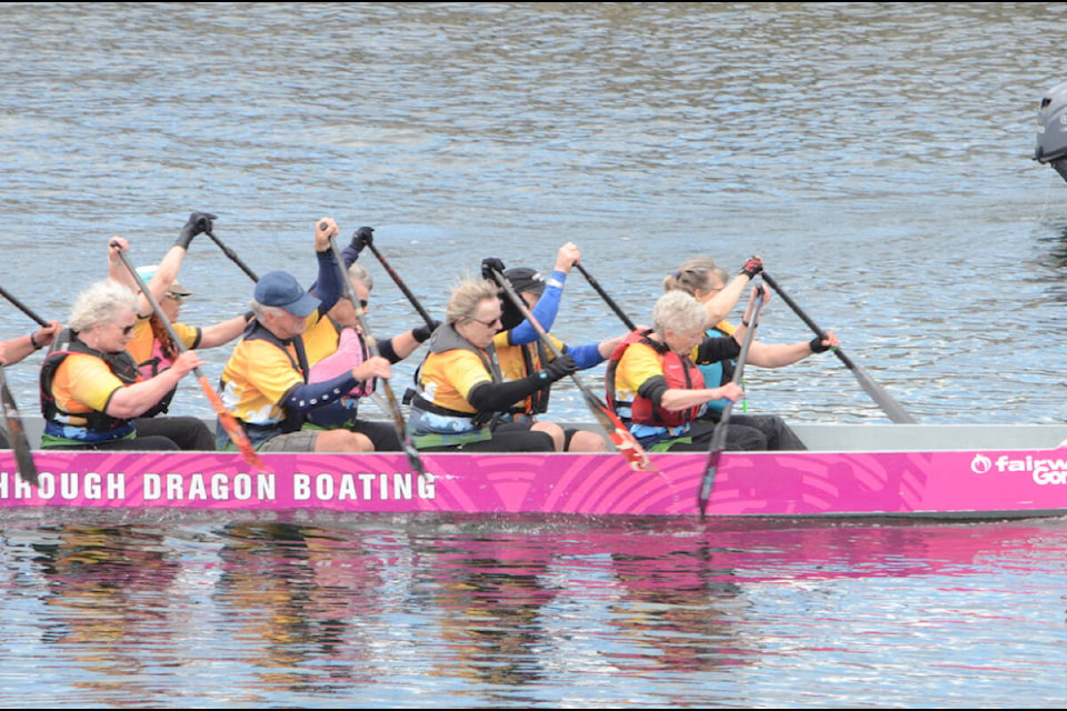 Members of the Prevailing Wins bring the boat in after a race. Photo by Mike Chouinard