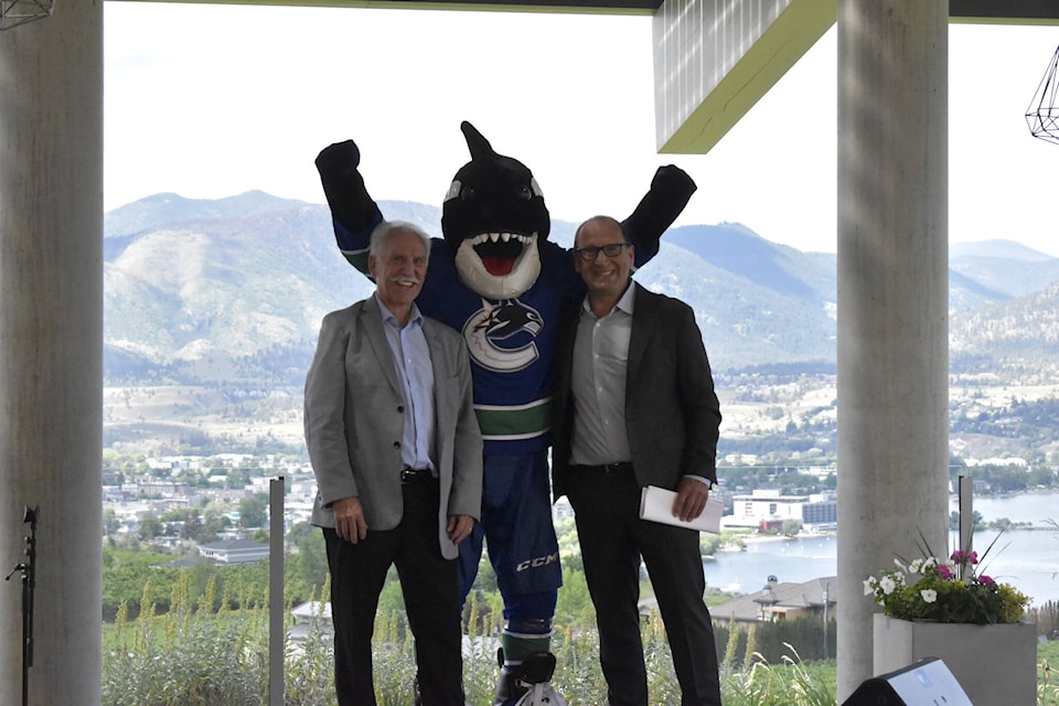 Vancouver Canucks legend Stan Smyl joined by Penticton mayor John Vassilaki and the team’s mascot, Fin, for the formal announcement that the Young Stars Classic is coming back to the city. (Logan Lockhart- Western News)