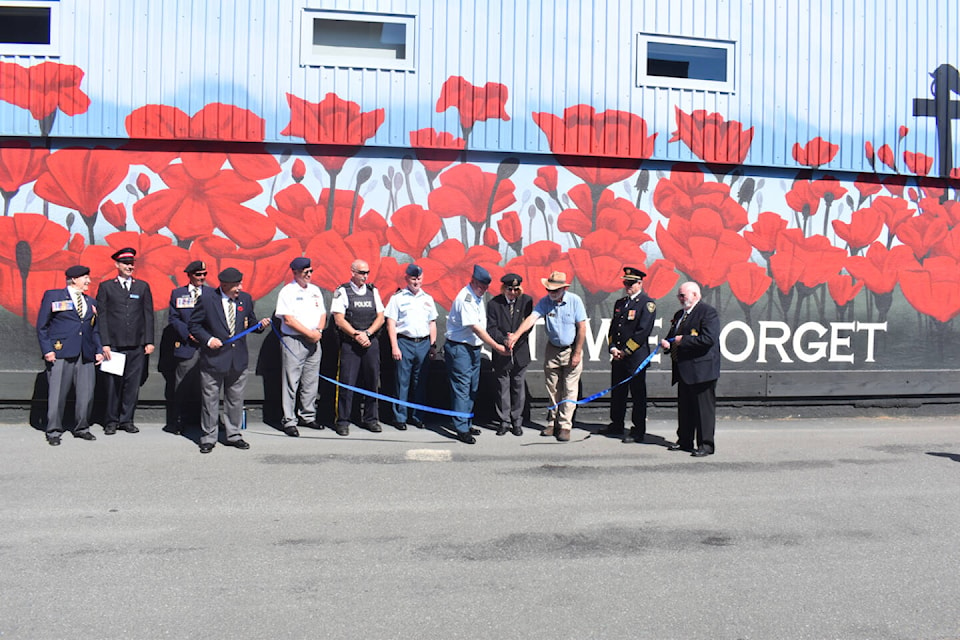 Legion members and community dignitaries were on hand for the official ribbon cutting of the new mural outside the Courtenay Legion. Photo by Terry Farrell