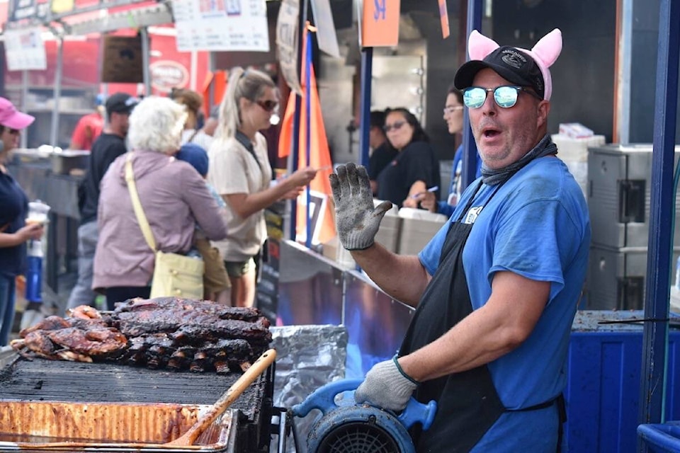 A member of the winning team, Boss Hog’s, was busy behind the grill Sunday at the annual Comox Valley Ribfest, which also ran Friday and Saturday at Cumberland Village Park. The Strathcona Sunrise Rotary club hosted the event. Scott Stanfield photos