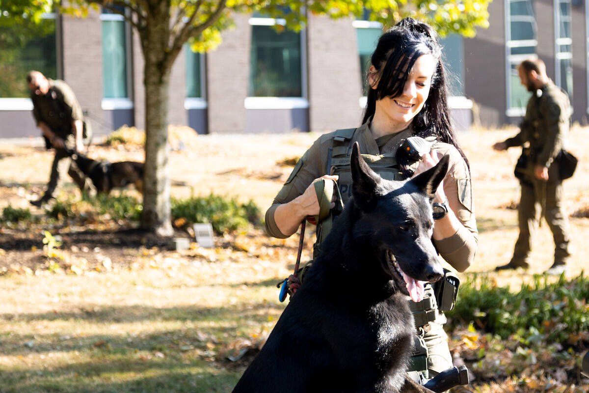 Const. Britteny George, Ridge Meadows RCMP, with Porter at the BC RCMP headquarters in Surrey on Tuesday, Sept. 27. (Photo: Anna Burns)