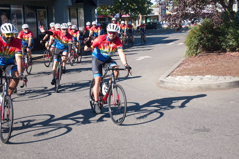 Adam Fras leads the Cops for Cancer Tour de Rock into Thrifty Foods in Parksville on Sept. 29. (Kevin Forsyth photo) Adam Fras leads the Cops for Cancer Tour de Rock into Thrifty Foods in Parksville on Sept. 29. (Kevin Forsyth photo)