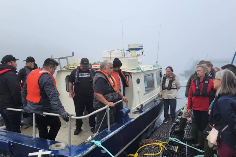 Fisheries Minister Joyce Murray tours a Mowi Canada West salmon farm on Oct. 14 where she was hosted by the Gwa’sala-‘Nakwaxda’xw First Nations whose territory the farm is located in. (Supplied photo)