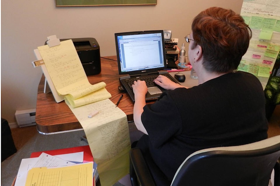 Cynthia Lebrun is seen here working on her manuscript. Photo supplied