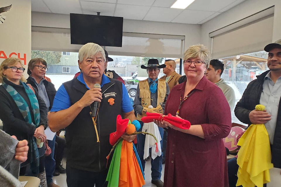 Wayne Christian, Secwépemc Nation representative and one of the three Interior Region representatives to the First Nations Health Council presents First Nations Wellness Centre executive director Debbie Grimes with an eagle’s feather during the grand opening of the new centre in Williams Lake Friday, Nov. 4. (Monica Lamb-Yorski photo - Williams Lake Tribune)