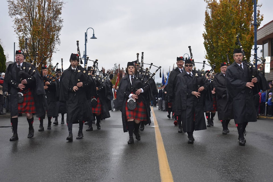The Comox Valley Pipe Band leads the procession at the Comox Remembrance Day service. Photo by Terry Farrell